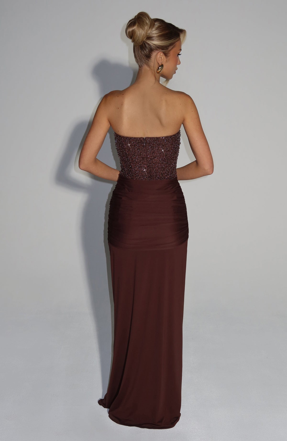 Women's strapless sequined maxi dress with sweetheart neckline and draped floor-length skirt
