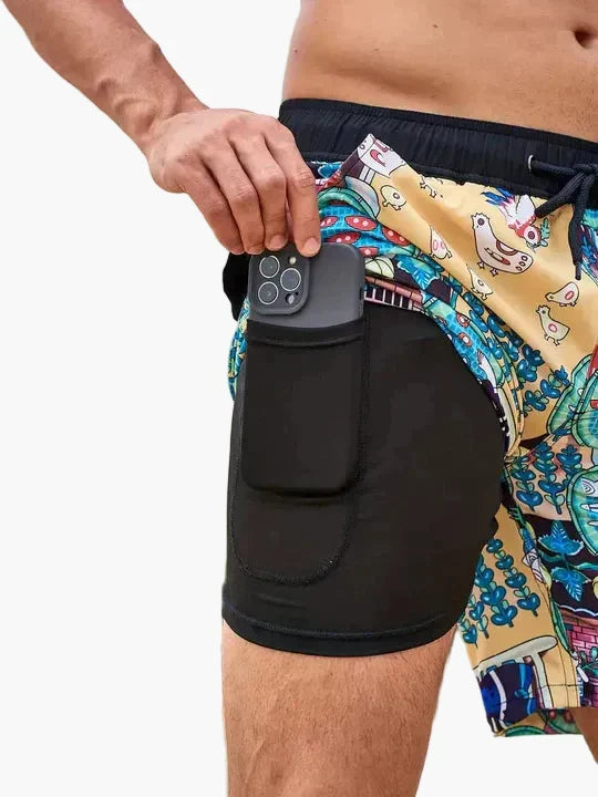 Men's tropical print swim shorts with drawstring waist and inner compression shorts