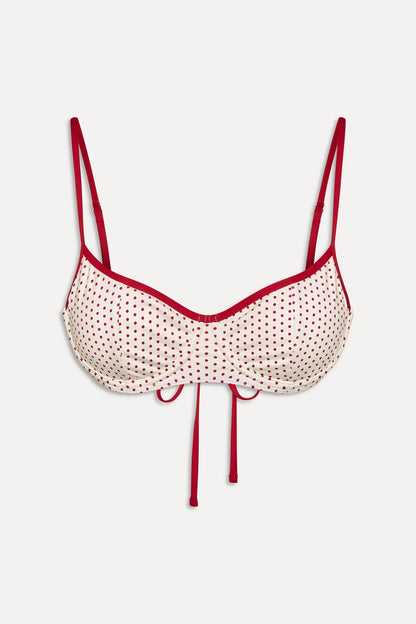Women's polka dot underwire bikini top with narrow straps and contrast trim