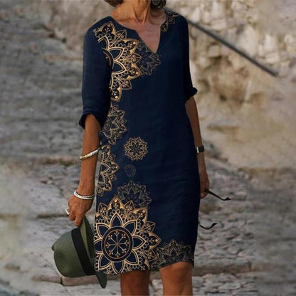 Women's printed knee-length shift dress with V-neck and three-quarter sleeves