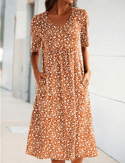 Women's floral midi dress with short sleeves, round neckline and side pockets
