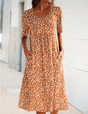 Women's floral midi dress with short sleeves, round neckline and side pockets