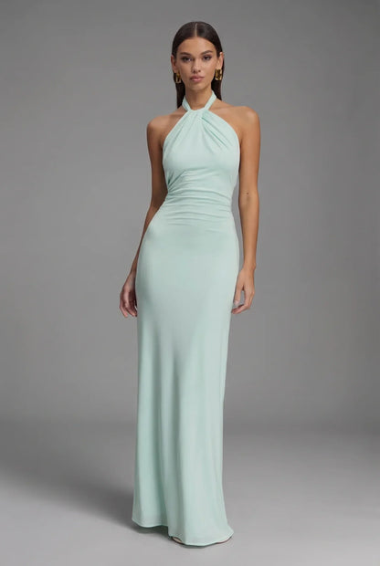 Women's fitted halter maxi dress with gathered ruching and floor-length skirt