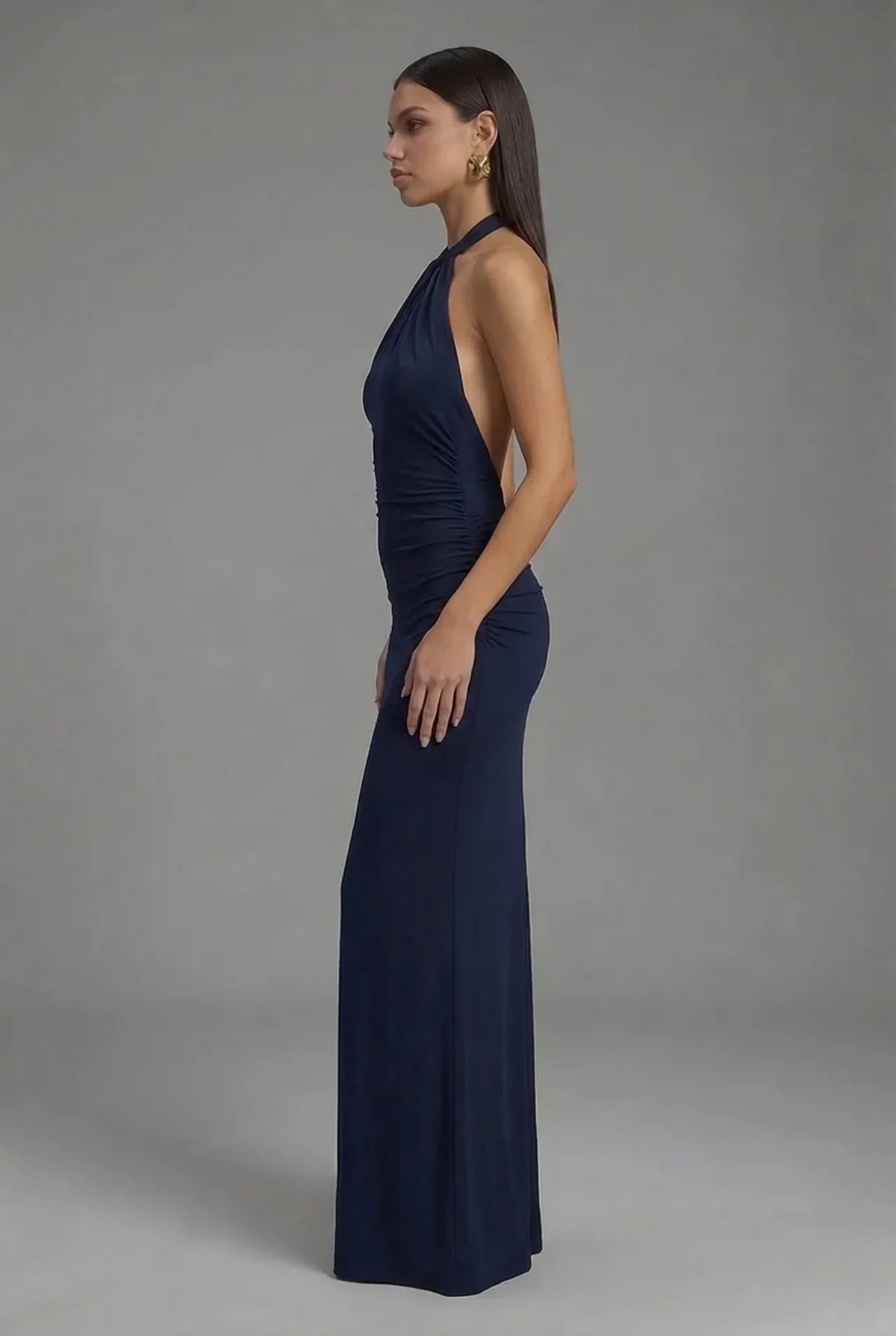 Women's fitted halter maxi dress with gathered ruching and floor-length skirt
