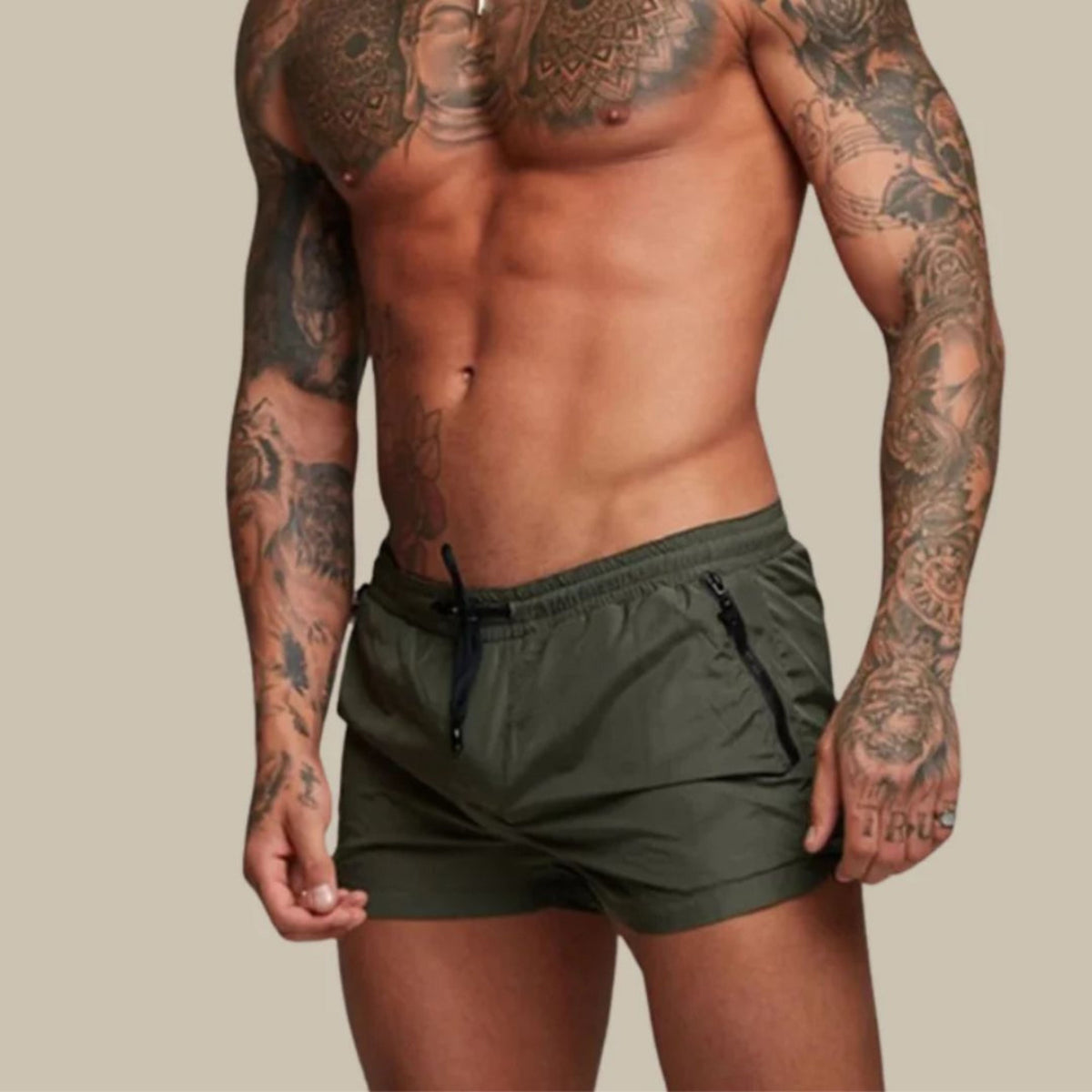 Men's plain swim shorts with elasticated drawstring waist and zipped side pockets