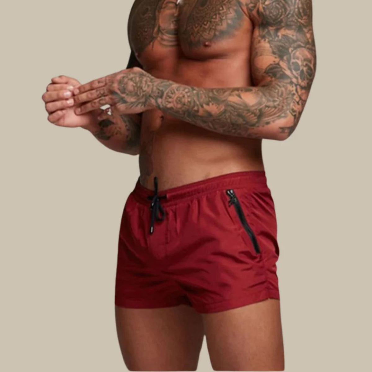 Men's plain swim shorts with elasticated drawstring waist and zipped side pockets