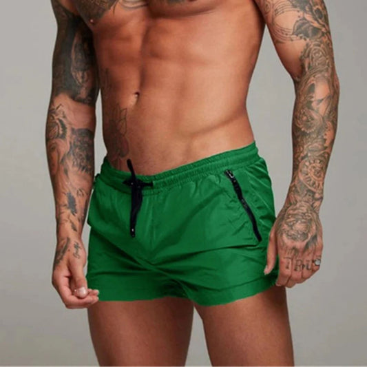 Men's plain swim shorts with elasticated drawstring waist and zipped side pockets