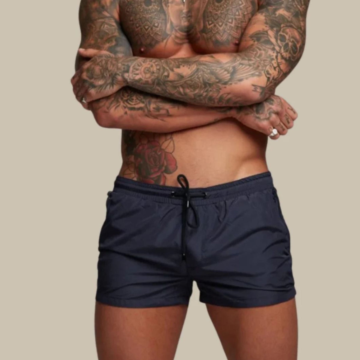 Men's plain swim shorts with elasticated drawstring waist and zipped side pockets