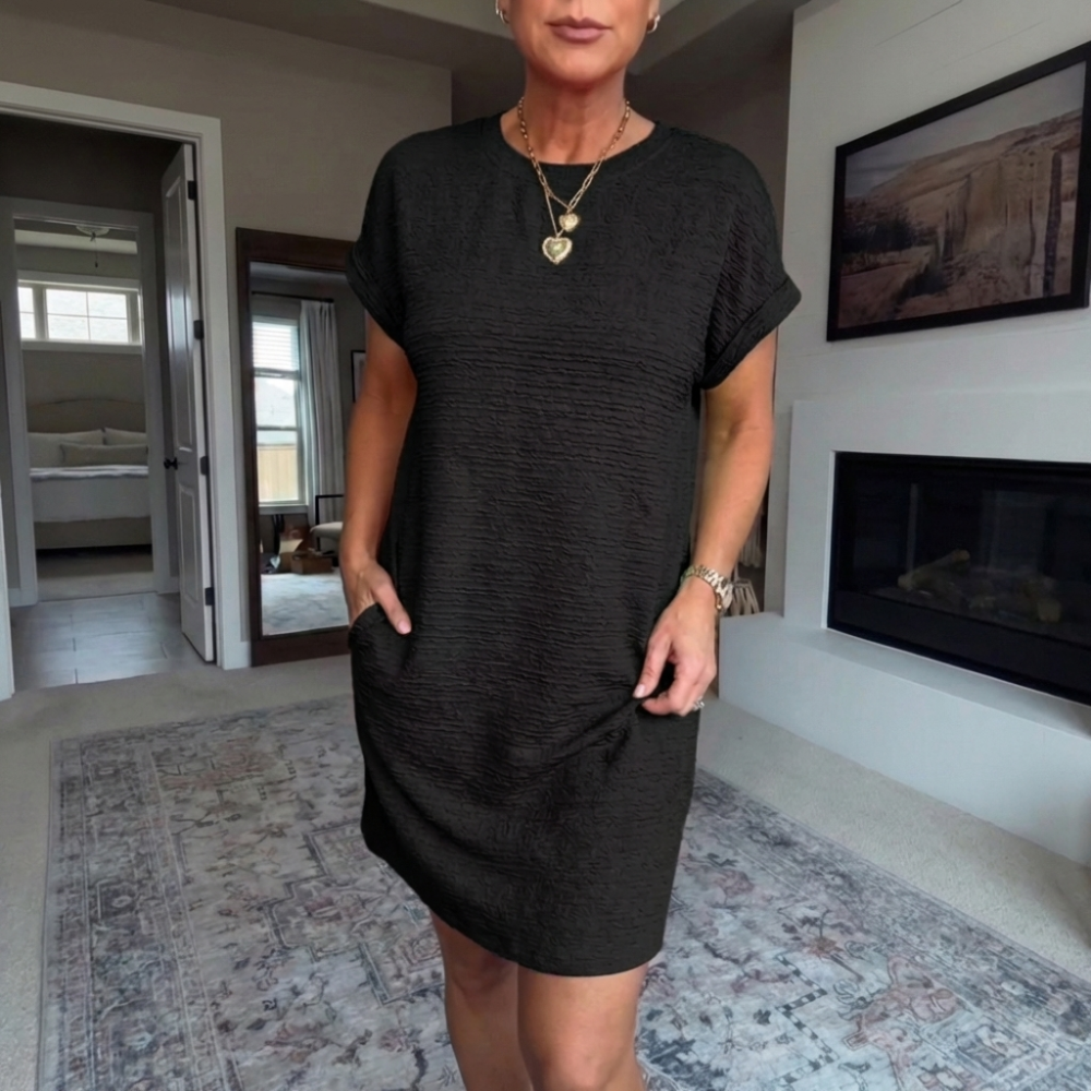 Women's textured short dress with crew neckline, short sleeves and side pockets