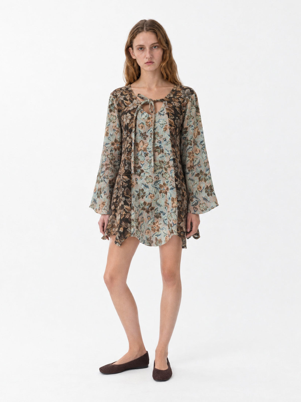 Women's floral patchwork mini dress with long flared sleeves and front tie neckline