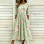 Green floral midi dress with crew neckline, three-quarter sleeves and gathered waist