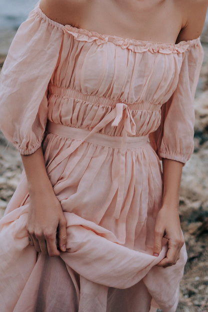 Women's pale pink off-shoulder maxi dress with puff sleeves and tie waist