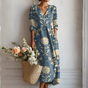Women's floral midi dress with V-neckline and three-quarter sleeves