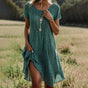 Women's polka dot midi dress with V-neckline and short sleeves