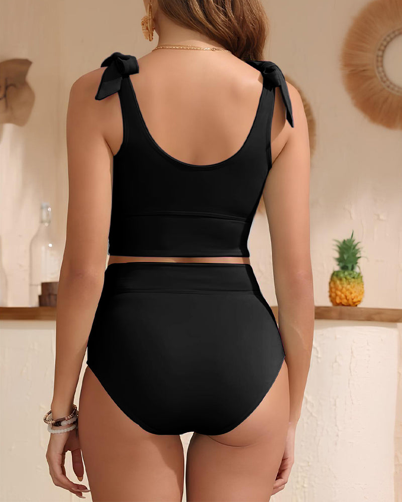 Women's high-waisted bikini set with tie-shoulder crop top and side bow detail