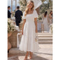 Women's textured tiered midi dress with square neckline and short puff sleeves