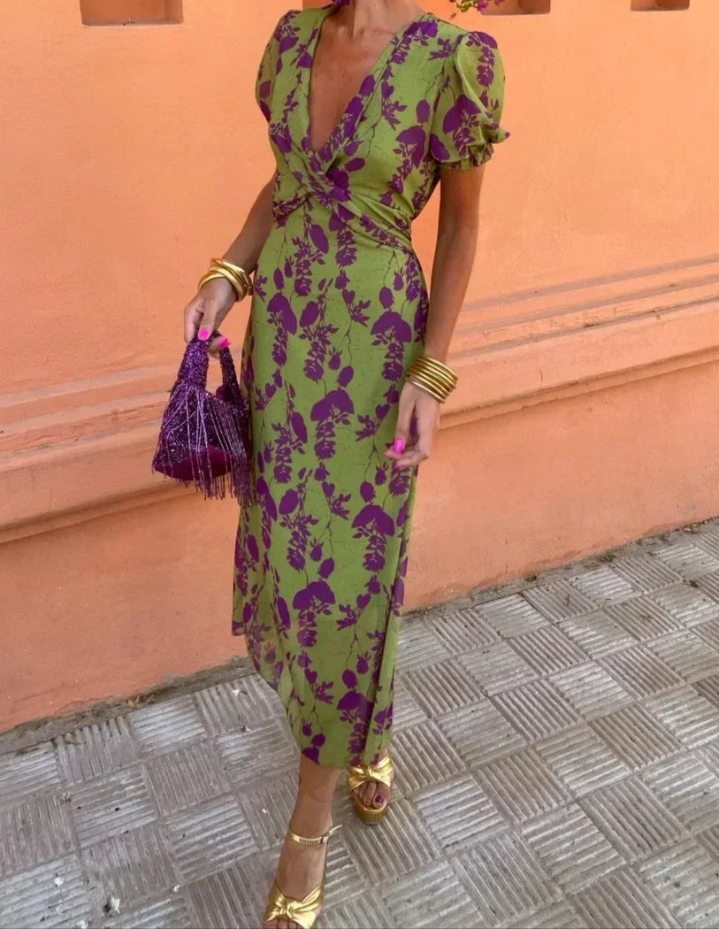 Women's green floral wrap midi dress with purple flowers and short sleeves
