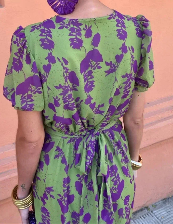 Women's green floral wrap midi dress with purple flowers and short sleeves