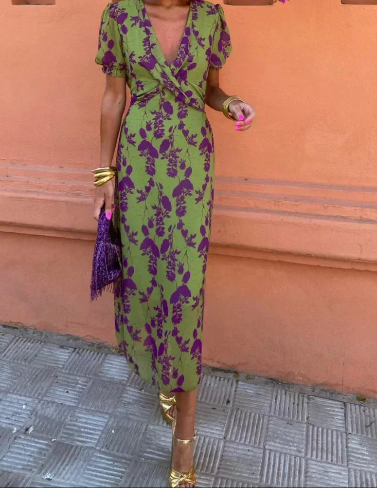 Women's green floral wrap midi dress with purple flowers and short sleeves