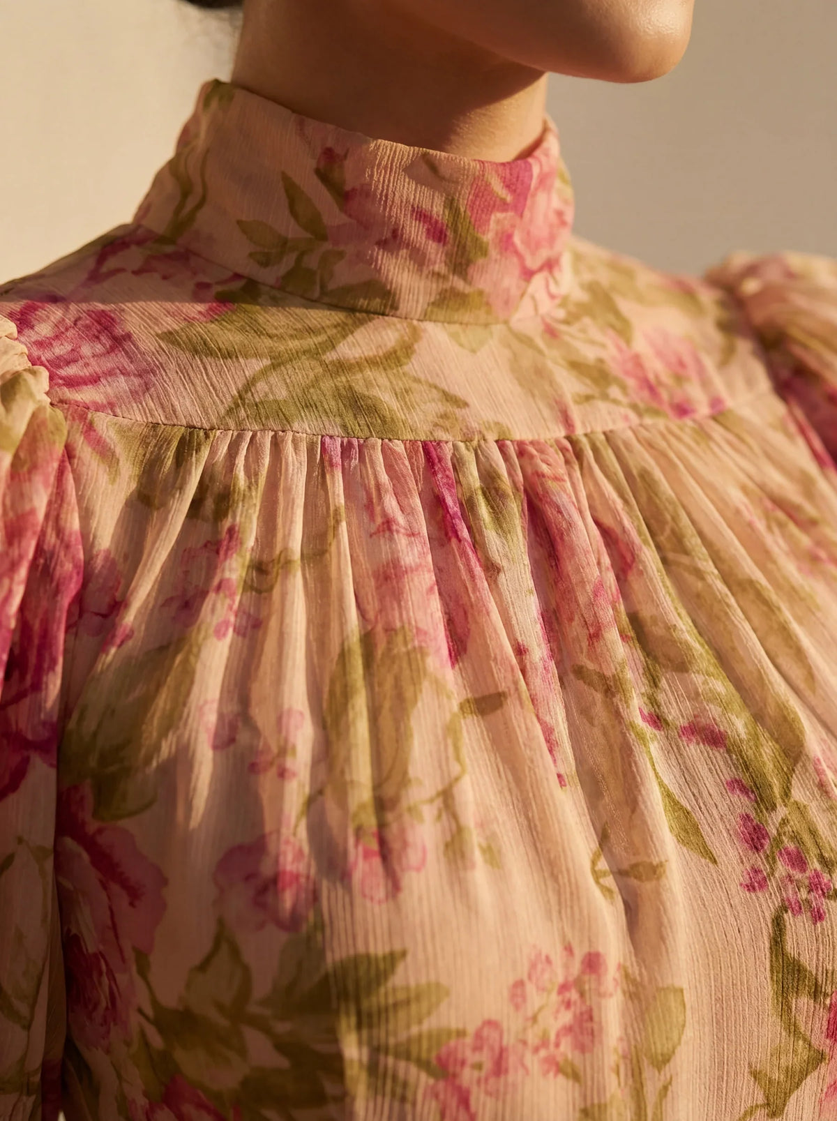 Women's pink floral maxi dress with high neck, puff sleeves and ruffled hem