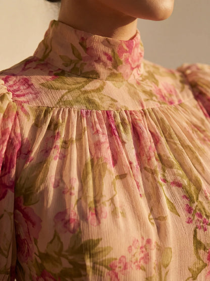 Women's pink floral maxi dress with high neck, puff sleeves and ruffled hem