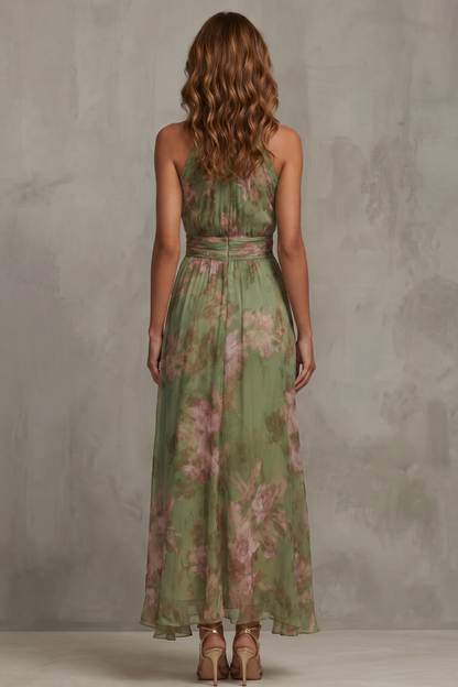 Green floral halter maxi dress with waist sash and flowing skirt