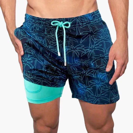 Men's tropical print swim shorts with drawstring waist and inner compression shorts