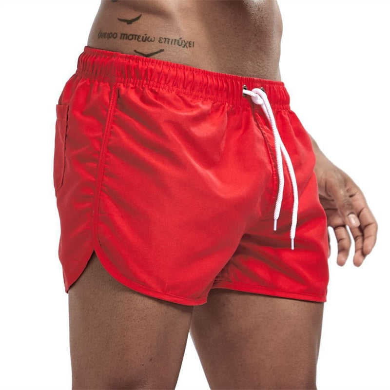 Men's plain swim shorts with elasticated waistband and drawstring
