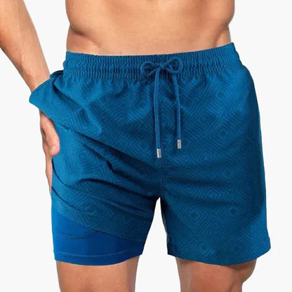 Men's tropical print swim shorts with drawstring waist and inner compression shorts