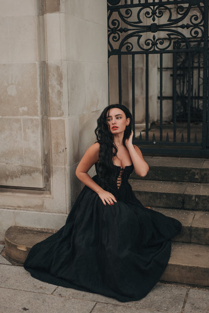Women's sleeveless lace-up corset maxi dress with a full floral skirt
