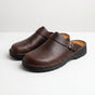 Men's closed-toe mule shoes with buckle straps and raised black soles