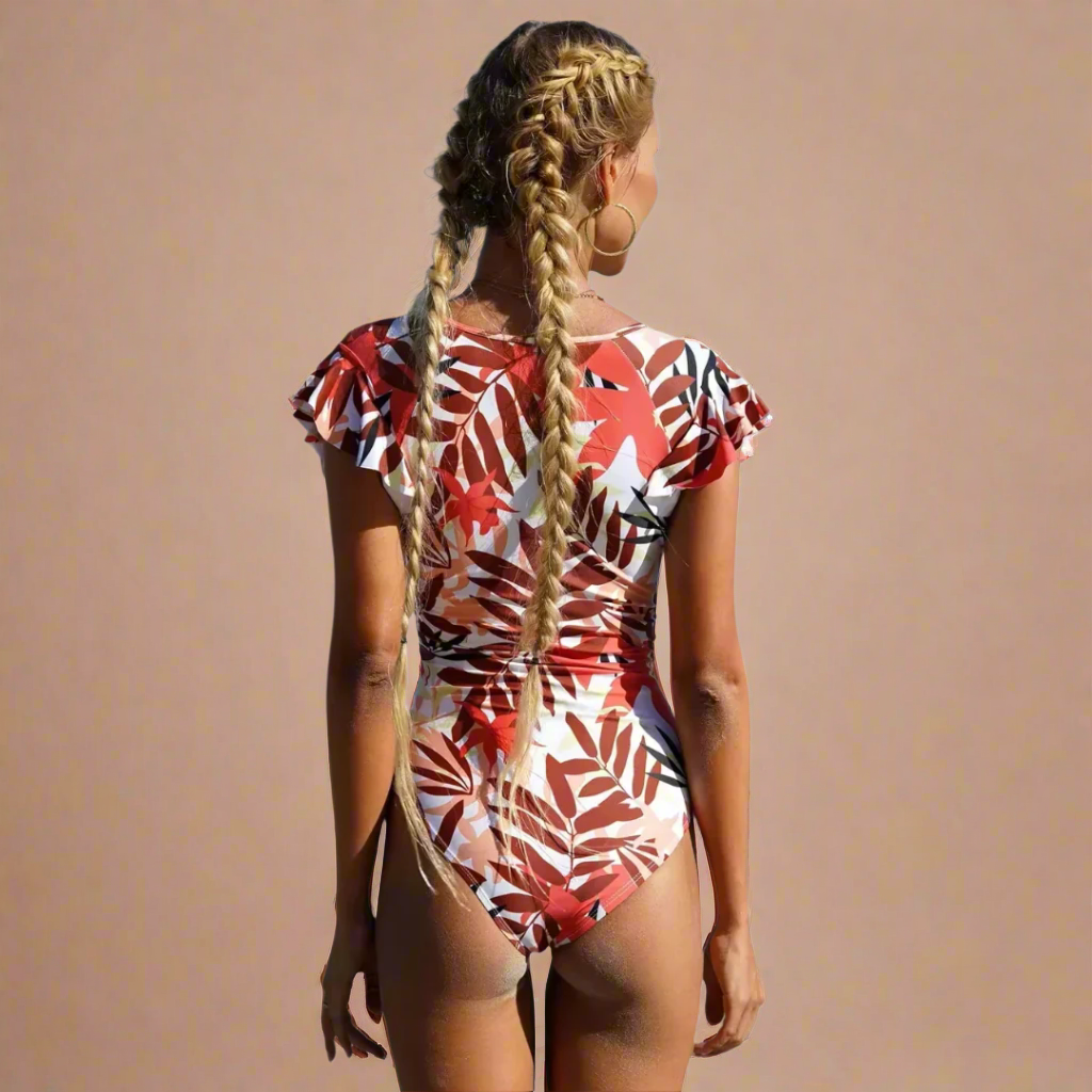 Women's short-sleeve one-piece swimsuit with front zip and leafy print