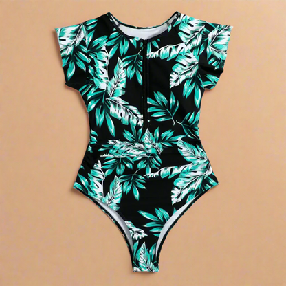Women's short-sleeve one-piece swimsuit with front zip and leafy print