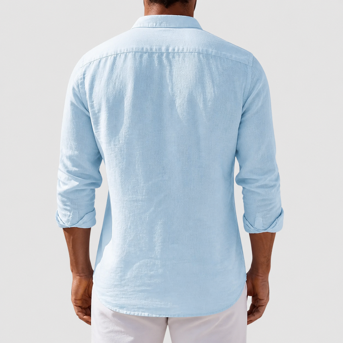 Men's long-sleeve button-front shirt with classic collar and curved hem