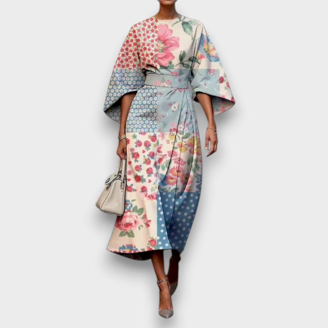 Women's floral midi dress with round neckline and flowing cape sleeves