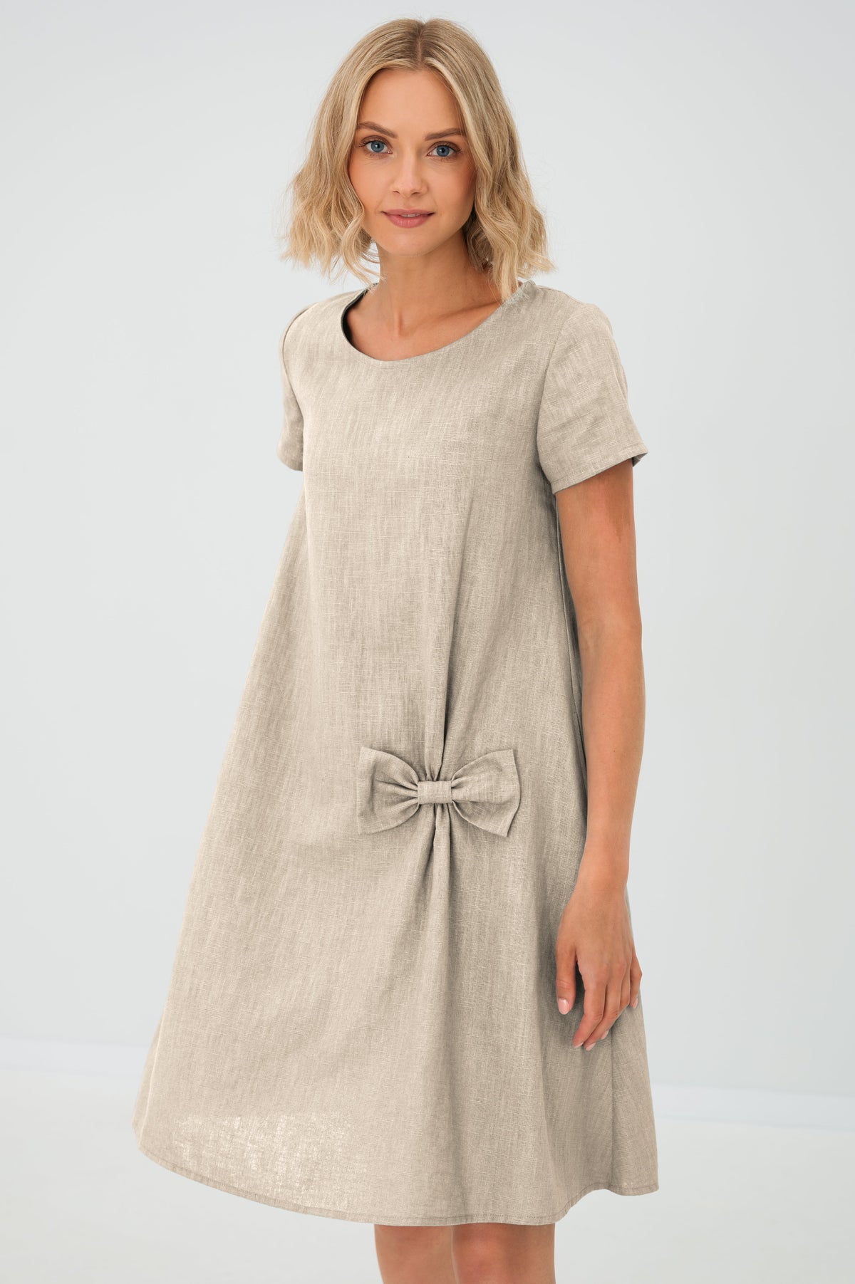 Women's A-line short dress with round neckline, short sleeves, bow detail and front pockets
