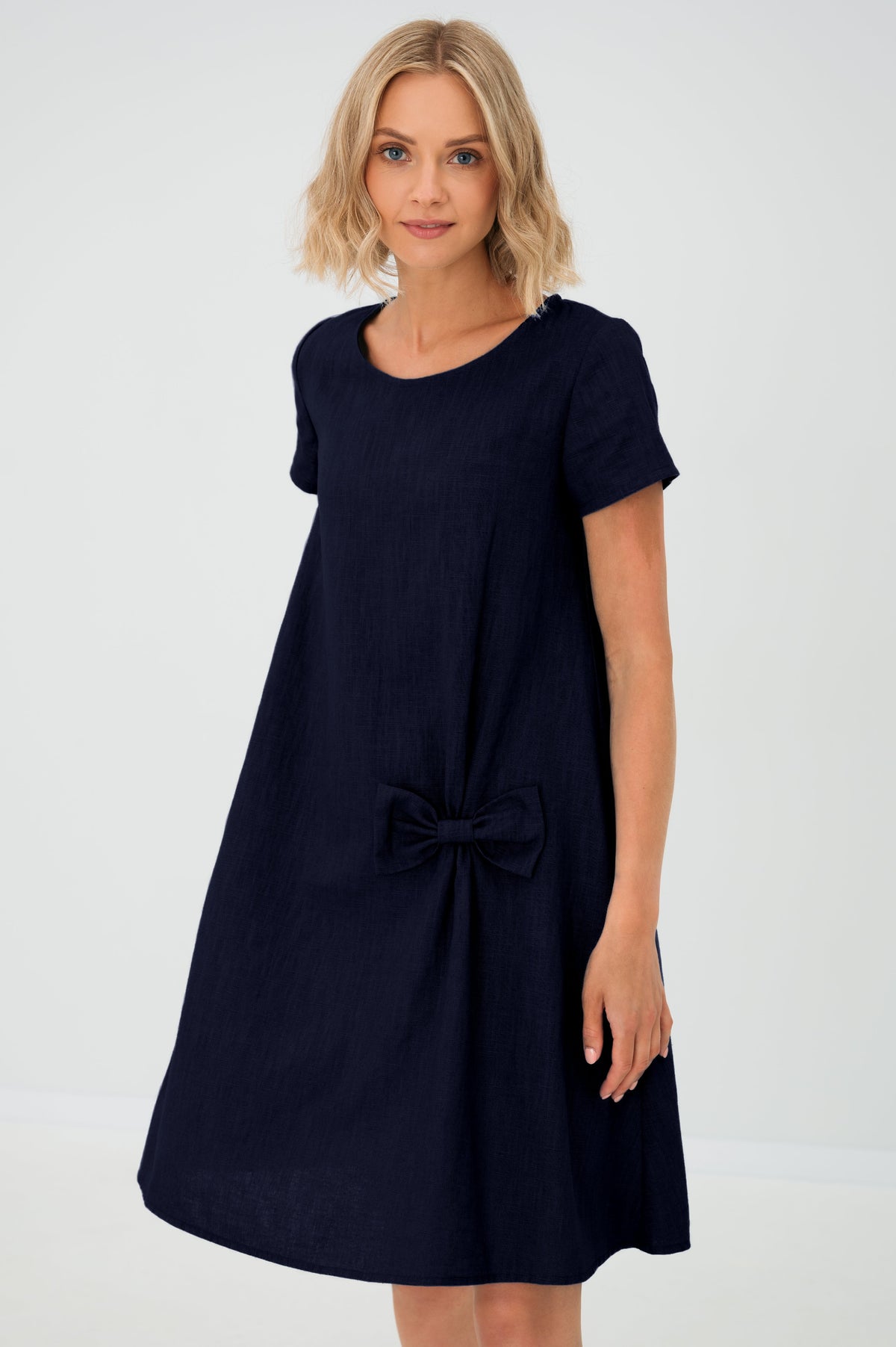 Women's A-line short dress with round neckline, short sleeves, bow detail and front pockets