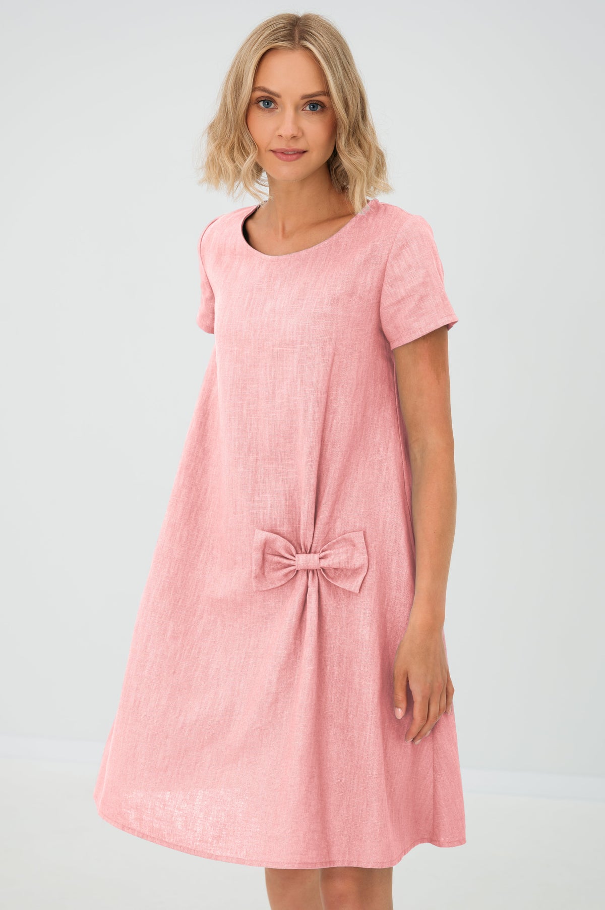 Women's A-line short dress with round neckline, short sleeves, bow detail and front pockets