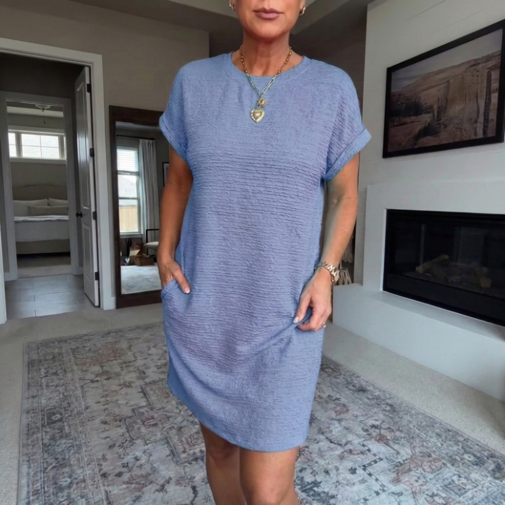 Women's textured short dress with crew neckline, short sleeves and side pockets