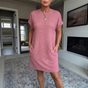 Women's textured short dress with crew neckline, short sleeves and side pockets