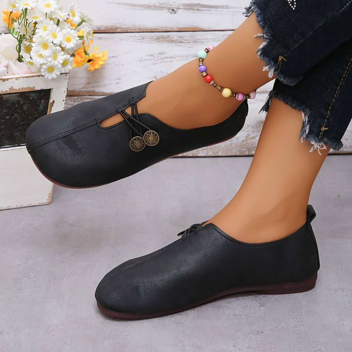 Women's slip-on flat shoes with round toes and button-style elastic detail