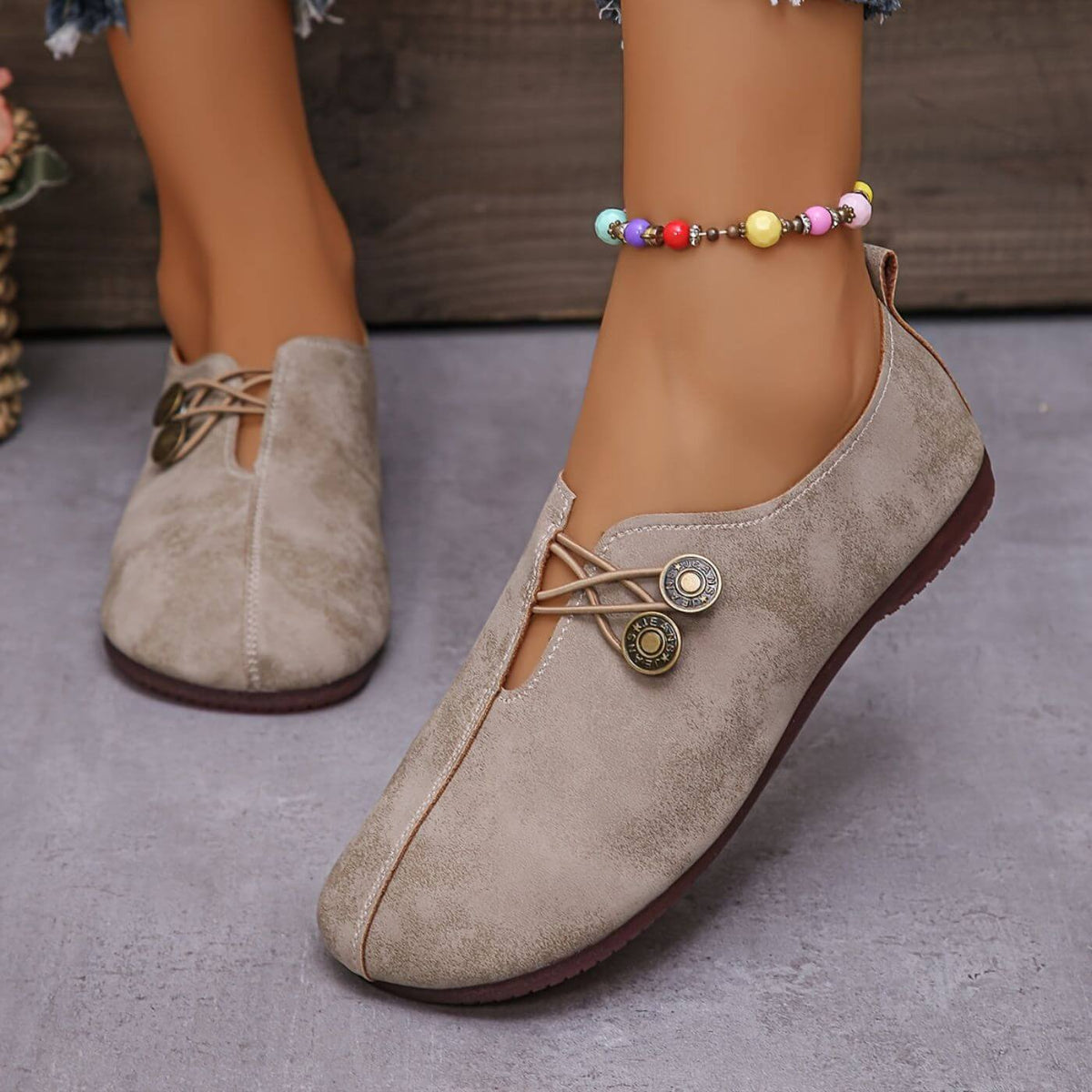 Women's slip-on flat shoes with round toes and button-style elastic detail