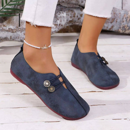 Women's slip-on flat shoes with round toes and button-style elastic detail
