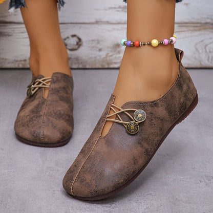 Women's slip-on flat shoes with round toes and button-style elastic detail