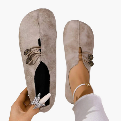 Women's slip-on flat shoes with round toes and button-style elastic detail