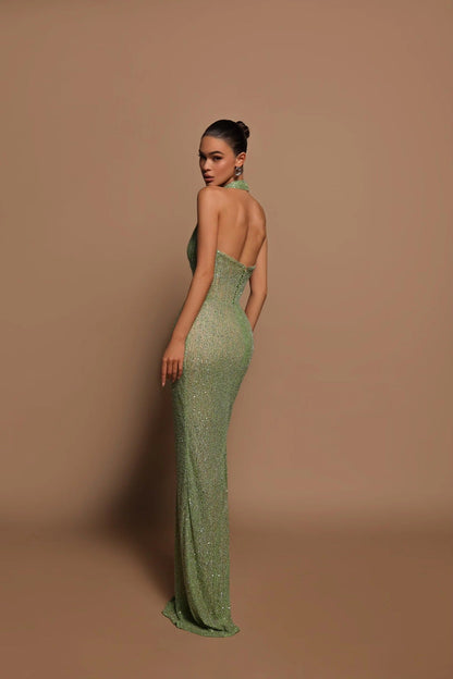 Women's green sequin halter maxi dress with plunging neckline and sleeveless fitted silhouette