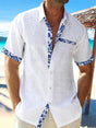 Men's short sleeve shirt with contrasting floral trim on the placket, cuffs and chest pocket