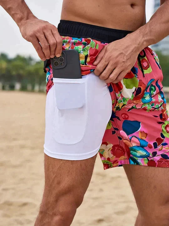 Men's printed swim shorts with drawstring waist and integrated compression liner