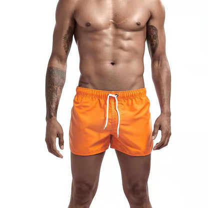 Men's solid swim shorts with elasticated drawstring waist and side pockets
