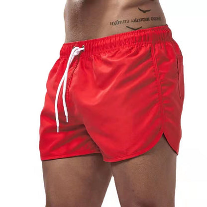 Men's solid swim shorts with elasticated drawstring waist and side pockets